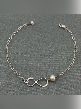 Elegant Sterling Silver Infinity Bracelet with Freshwater Pearl Accent